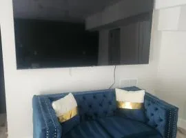 Modern Basement Suite • King Bed & 100” TV