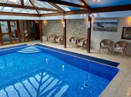 柯布赫谷仓乡村别墅，位于Uplyme的酒店