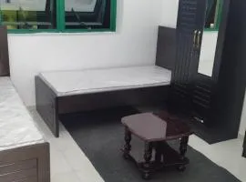 A bedroom with three beds for men only