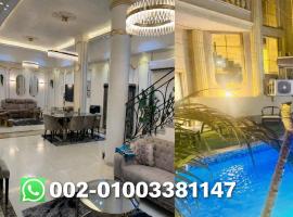 modern villa with coverable warm pool sheik zayed compound, khách sạn ở Sheikh Zayed