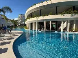 Stylish Playacar Condo with Balcony & Pool