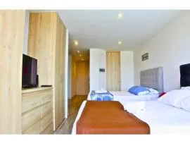 Oasis in Zona T with 2 Queen Beds, Pool, Sauna & Gym