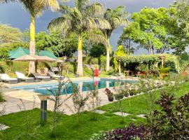 Uyoga House, hotel com piscinas em Arusha