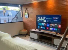 50 metros da praia,Ar condicionado na sala de estar e suíte, Área Gourmet