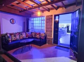 Urban Garden Hideaway Serene one-bedroom retreat with a private garden & chill veranda, 30 Minutes from JKIA