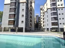 Gold and Elegant Ravic Homes Shawmut Suites with a Pool and Gym