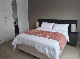 Greenstone Guesthouse, hotel i Muldersdrift