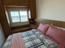 Apartamento aconchegante com vista para o mar