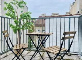 Rooftop Central Apartment with Balcony & Free Parking