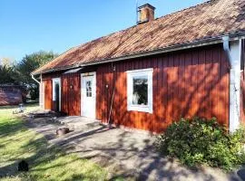 Charming red cottage in Vaderstad SE10024