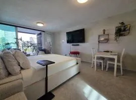 Serene Coastal Studio with King Bed & Balcony