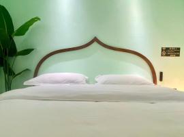 Mangshi Dai Elephant Mansion Hotel, hôtel à Mangshi