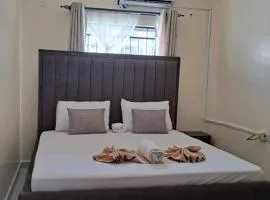Cozy 2 BR with 3 Beds, AC & Hot Shower at Buxton Point Apartments Off RG Road Gate A
