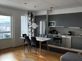 Bright 2BR Apartment with Lake Views, Free Parking & Sauna