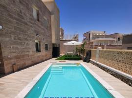 בית נופש - הדקל והים אילת, cabana o cottage a Elat