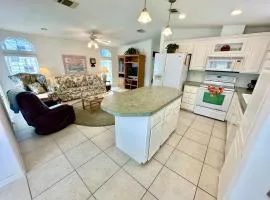 Come enjoy paradise in this awesome beach house with large open kitchen, dining and living area.