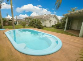 Casas Berti - Pátio incrível, piscina, 4 quartos, hotel din Arroio do Sal