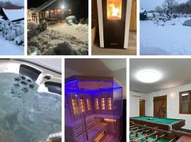 Slow leaving retreat in superior villa with heated pool, whirlpool, sauna, playground and barbeque in privacy near forest