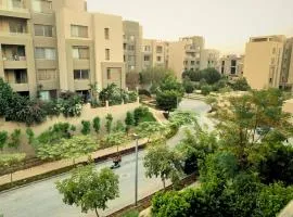 In Palm Hills Village Gate New Cairo Compound Faced AUC