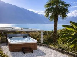 Lakeview Swiss Chalet with Hot Tub near Interlaken