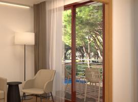 NM Suites by Escampa Hotels, отель в городе Пладжа-де-Аро