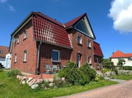 브리게에 위치한 호텔 Ferienwohnung Boddenzander