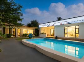 石梅湾拾里民宿, hotel a Wanning