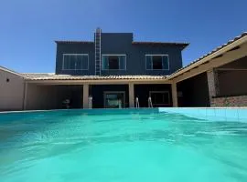 Casa com piscina, hidromassagem e vista para o mar