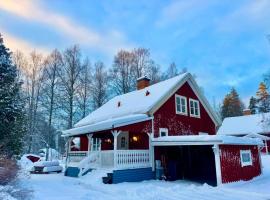 House near forest and water, hotel a Hagfors