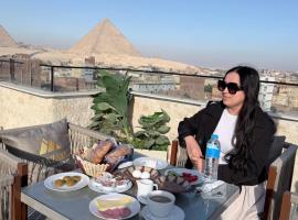 Mazaya Pyramids view inn, hotel pro pobyt s dom&aacute;c&iacute;mi mazl&iacute;čky v destinaci Giza