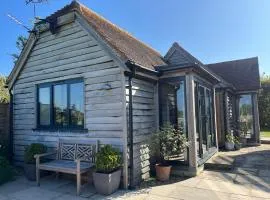 The Acorn Goodwood luxury lodge house 10 minute walk from Goodwood Festival of Speed