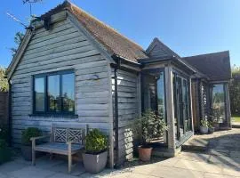 The Acorn Goodwood luxury lodge house 10 minute walk from Goodwood Festival of Speed