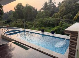 Entire private villa with infinity pool field view - Villa Astra Azul, Hotel in Dramapur
