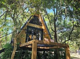 Um chalé e um riacho no meio da natureza، فندق في غاسبار