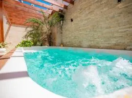Getaway room with shared Jacuzzi in the center