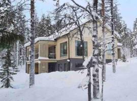 Luxury log villa with hot tub, hotel en Ylläsjärvi