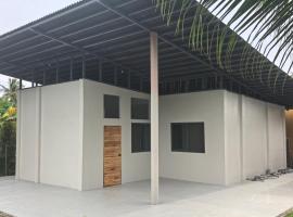 Concrete house with one big room, hotel i Samal