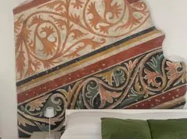 Bright frescoed attic in the city center, Brescia