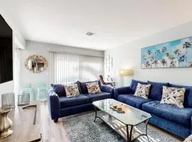 Water-view dog-friendly home with outdoor space & entertainment options