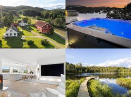 Luksusfølelse i hjertet av naturen med jacuzzi，Norem的飯店