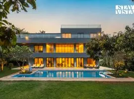 Reflection House by StayVista with Pool, Terrace bar, Indoor games & Exquisite interiors in a nutshell