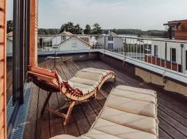 Holiday Home Modernes Ferienhaus mit Sauna- Seeblick- Dachterrasse und Garten by Interhome