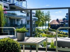 Lake Apart Ostróda - widok, przy plaży, aquapark, parking podziemny, winda, Netflix – hotel w Ostródzie