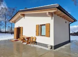 Baita Cornigol ai piedi delle Dolomiti