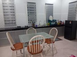 Mok Jah Homestay, готель у місті Macang