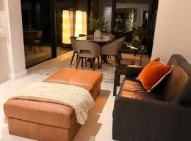 Modern Entire Home steps from the Train Station