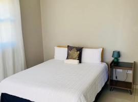Logo Luxury Guesthouse, hotel i Windhoek