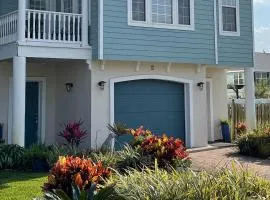 Two-level home with partial ocean view, balcony, WiFi, & W/D - walk to the beach
