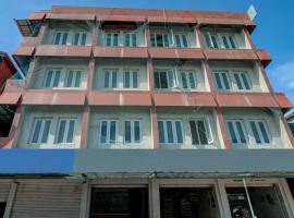 SPOT ON J P Tourist Home, отель в городе Коллам