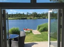 Holiday Home Holzhaus mit Terrasse- direkt an einer Bucht by Interhome